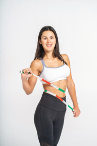 healthy-fit-girl-measuring-her-waist-after-fitness-exercise